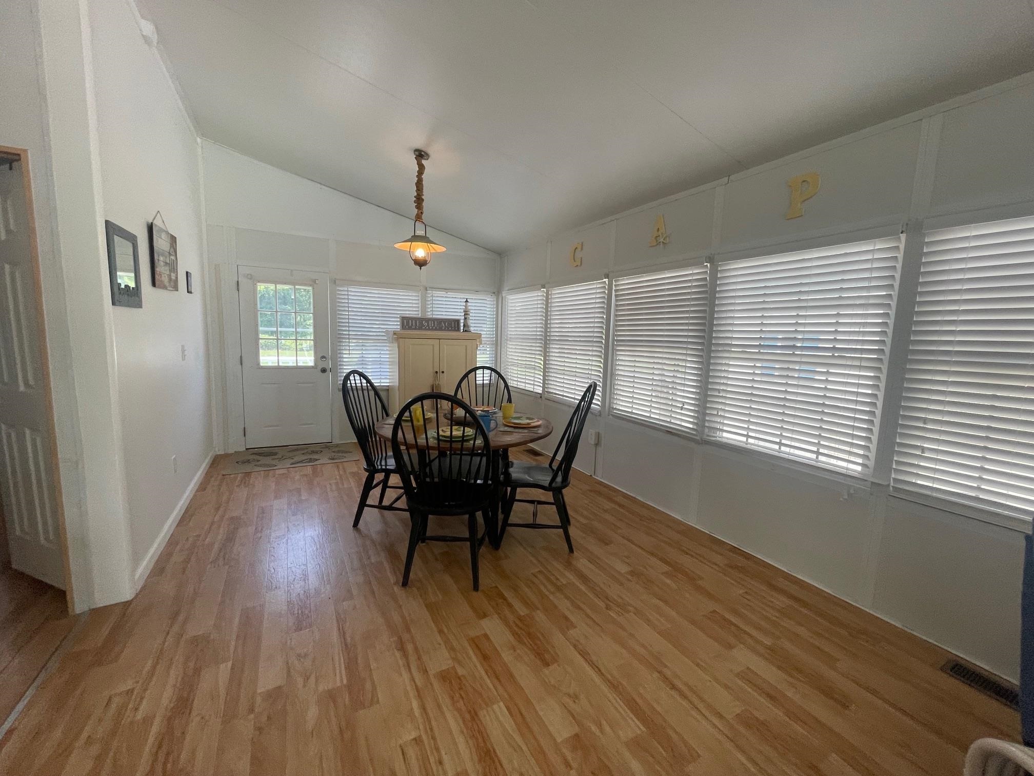 4100 Rte 9 South, Unit 9 Rio Grande, NJ 08242 - Photo 8 of 31 a view of a dining room with furniture window and wooden floor