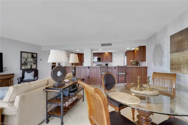 a view of a livingroom with furniture and a potted plant
