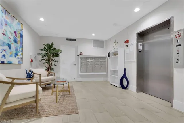 a view of a livingroom with furniture and a kitchen