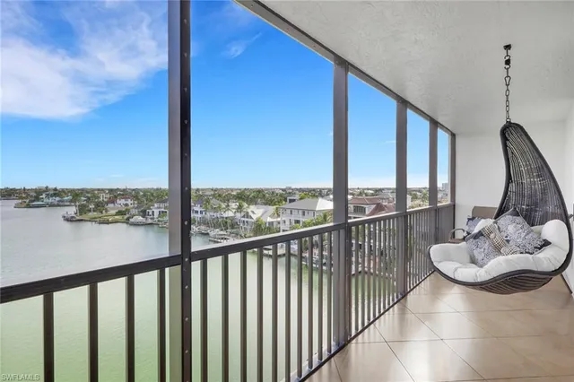 a view of a balcony with furniture