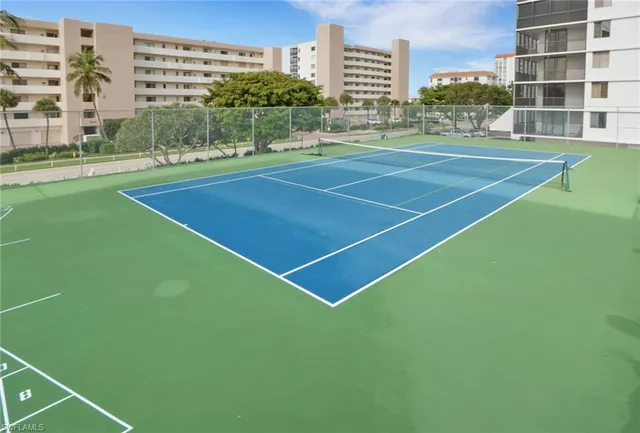 a terrace with outdoor seating and city view
