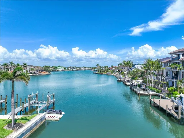 a view of a swimming pool with outdoor seating