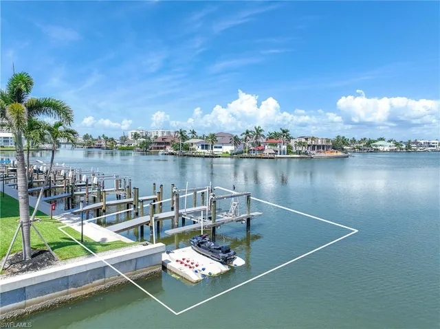 a view of a lake with sitting area