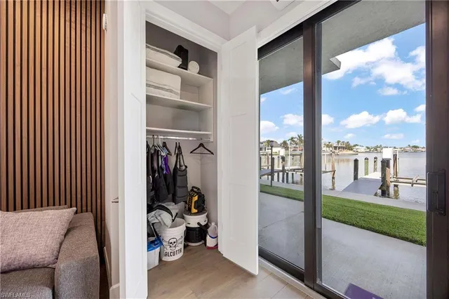 a view of a living room and a floor to ceiling window