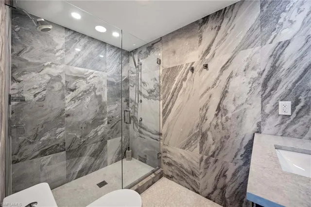 a bathroom with a toilet and shower