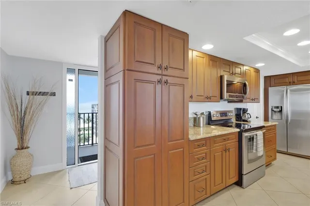 a kitchen with stainless steel appliances granite countertop a refrigerator oven a sink and dishwasher