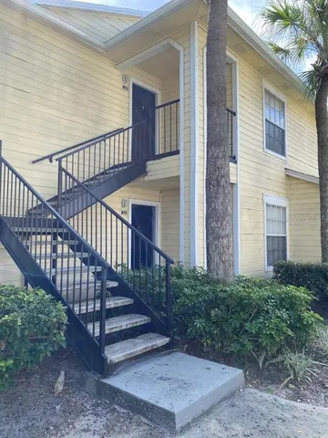 a view of staircase with wooden floor and fence