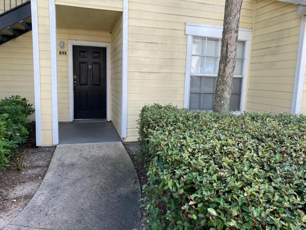 1089 South Hiawassee Road, Unit 313 Orlando, FL 32835 - Photo 2 of 10 a view of a pathway besides a building