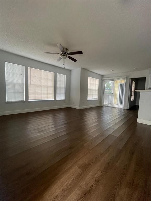 1089 South Hiawassee Road, Unit 313 Orlando, FL 32835 - Photo 7 of 10 a view of empty room with wooden floor and fan