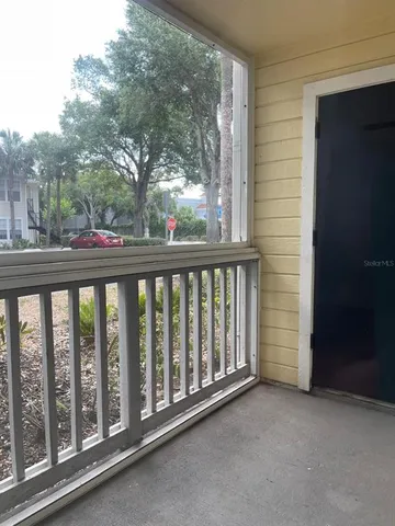 a view of a balcony with a swing
