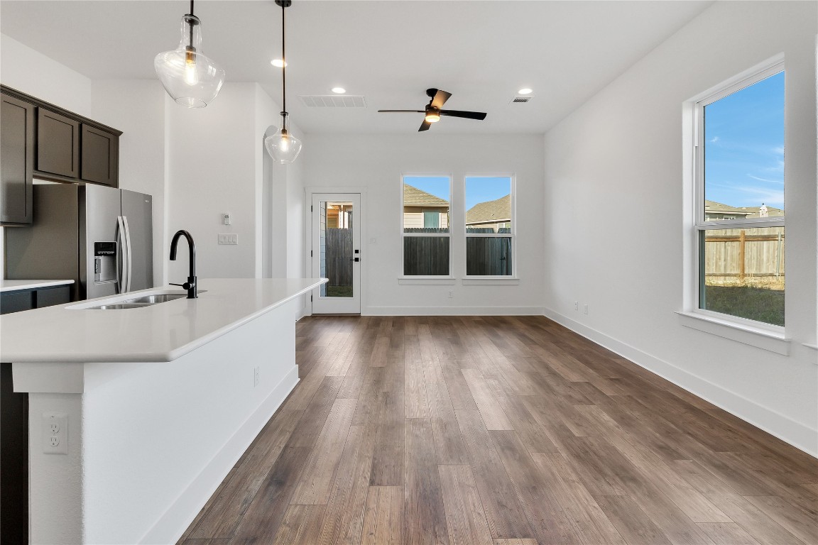 8589 Meridy Loop Round Rock, TX 78665 - Photo 36 of 36 a view of a kitchen with wooden floor and windows