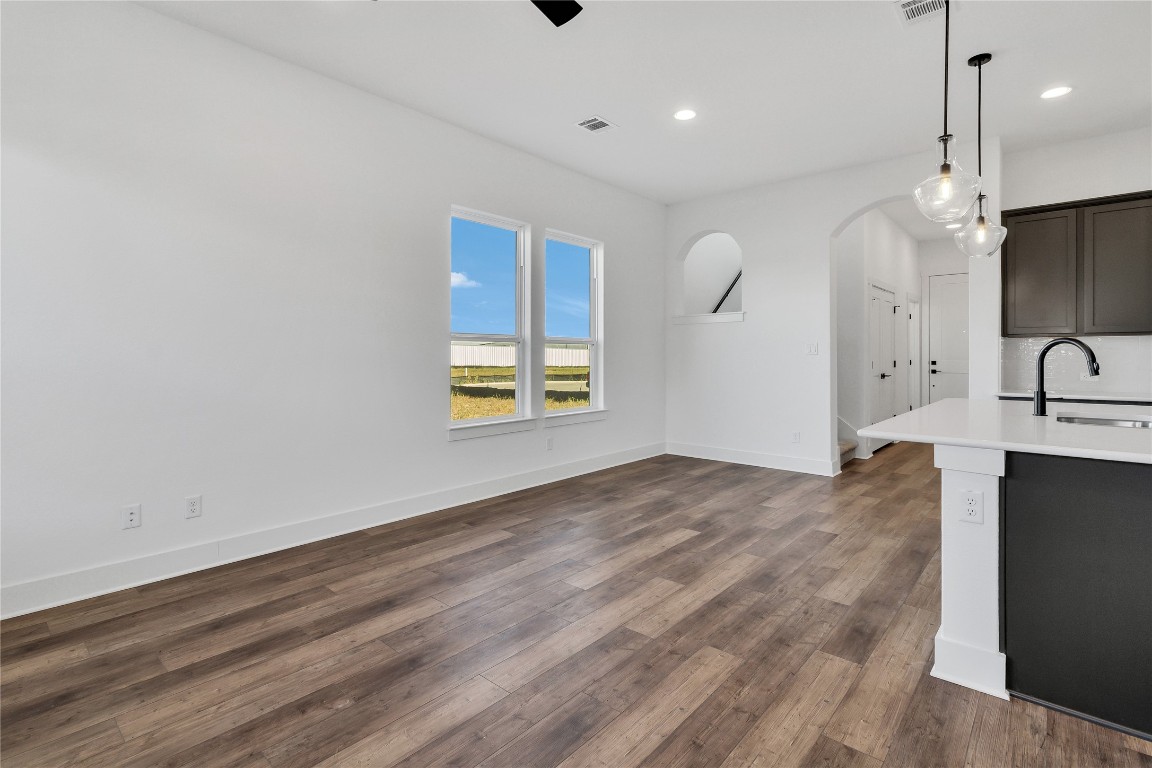 8589 Meridy Loop Round Rock, TX 78665 - Photo 16 of 36 a view of a kitchen with a sink and wooden floor