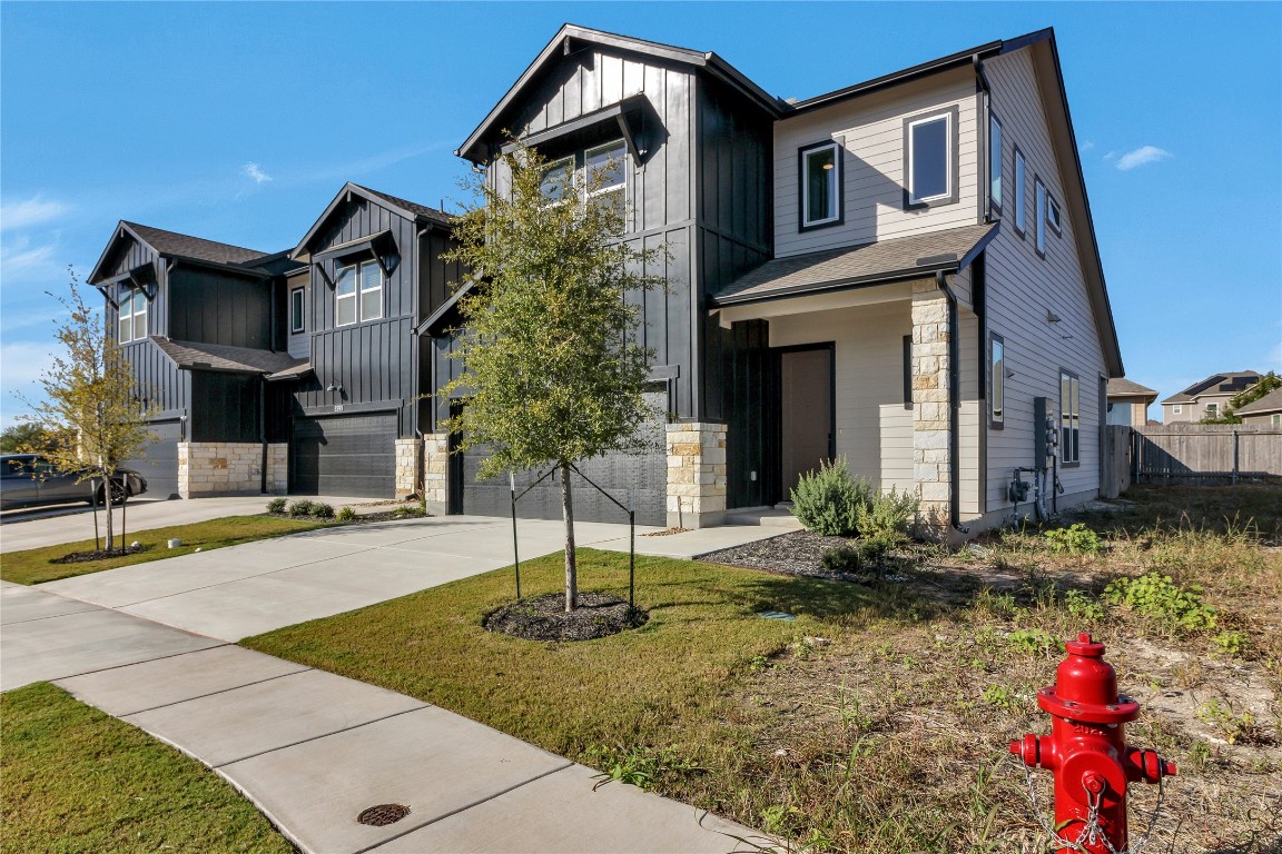 8589 Meridy Loop Round Rock, TX 78665 - Photo 2 of 36 a front view of a house with garden