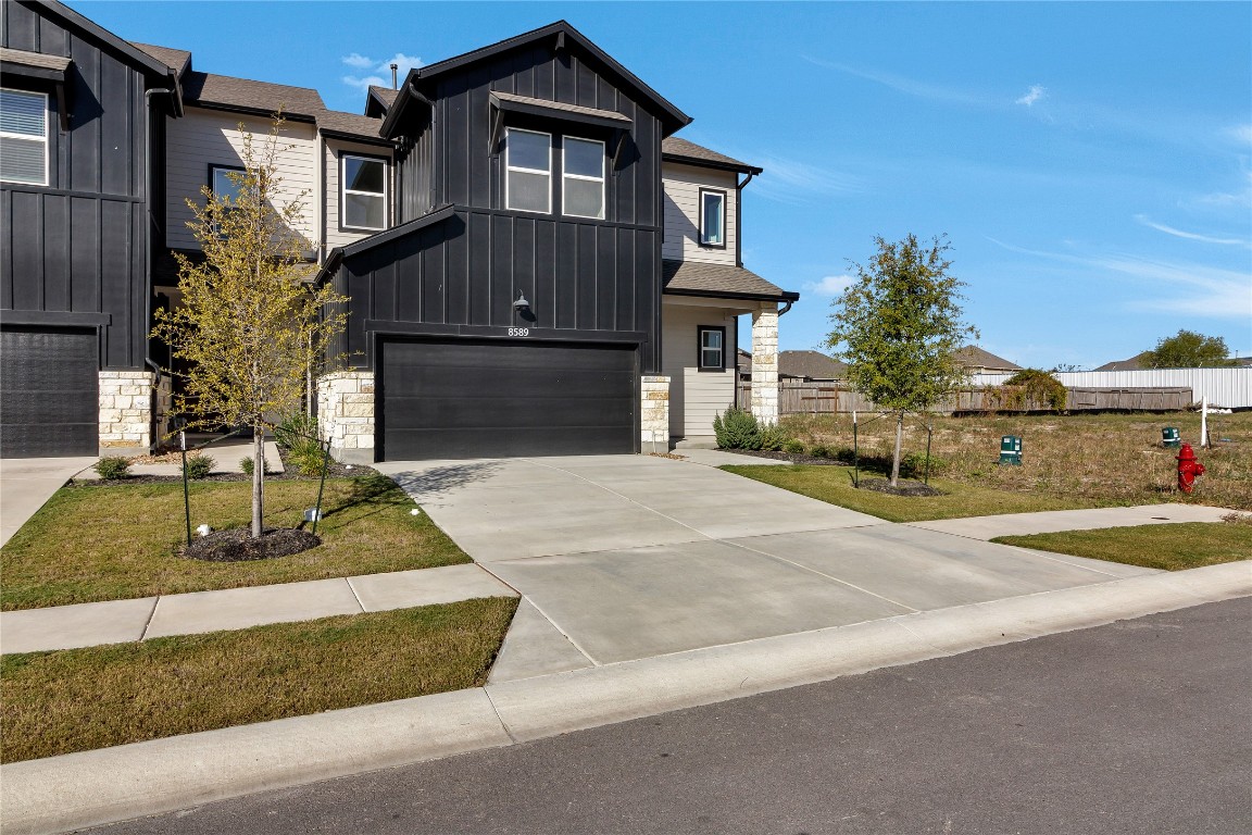 8589 Meridy Loop Round Rock, TX 78665 - Photo 3 of 36 a front view of a house with garden