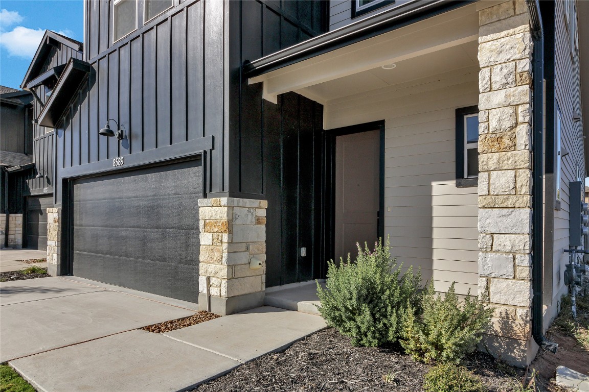 8589 Meridy Loop Round Rock, TX 78665 - Photo 4 of 36 a potted plant on the side of a building