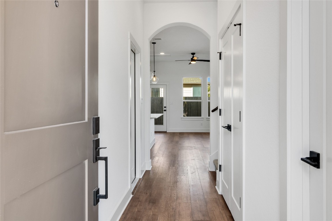 8589 Meridy Loop Round Rock, TX 78665 - Photo 6 of 36 a view of a hallway with wooden floor and closet