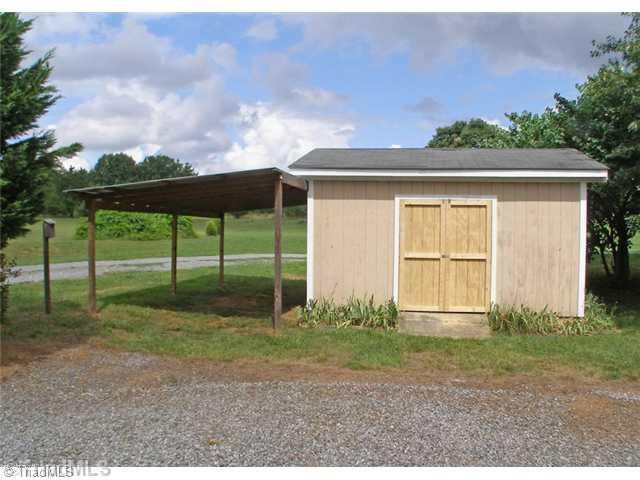 8422 Mears Fork Road Summerfield, NC 27358 - Photo 15 of 16 Other. Storage building or workshop with shed roof on side for parking