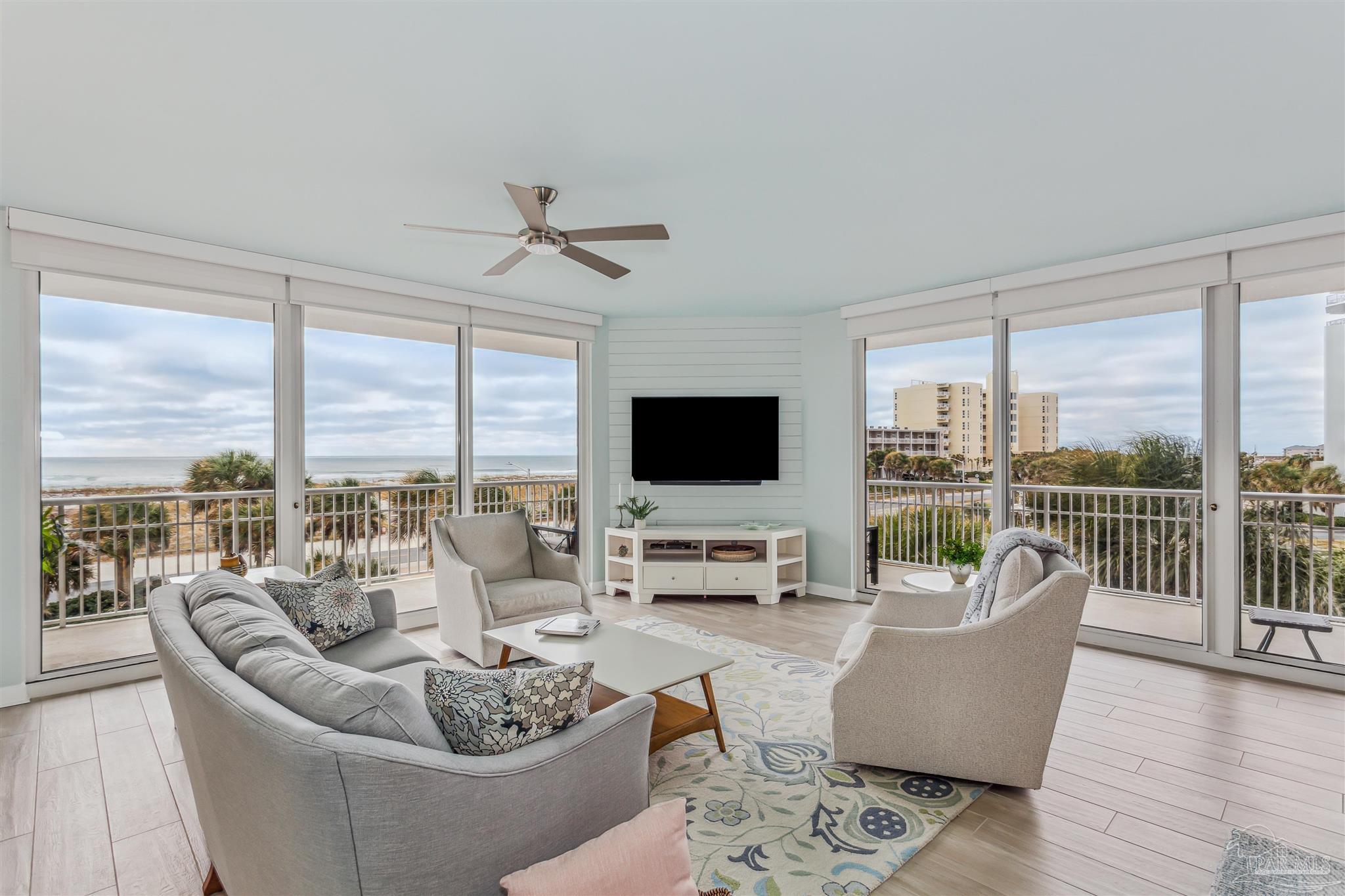 800 Fort Pickens Road, Unit 204 Pensacola Beach, FL 32561 - Photo 3 of 45 a living room with furniture tv and a large window
