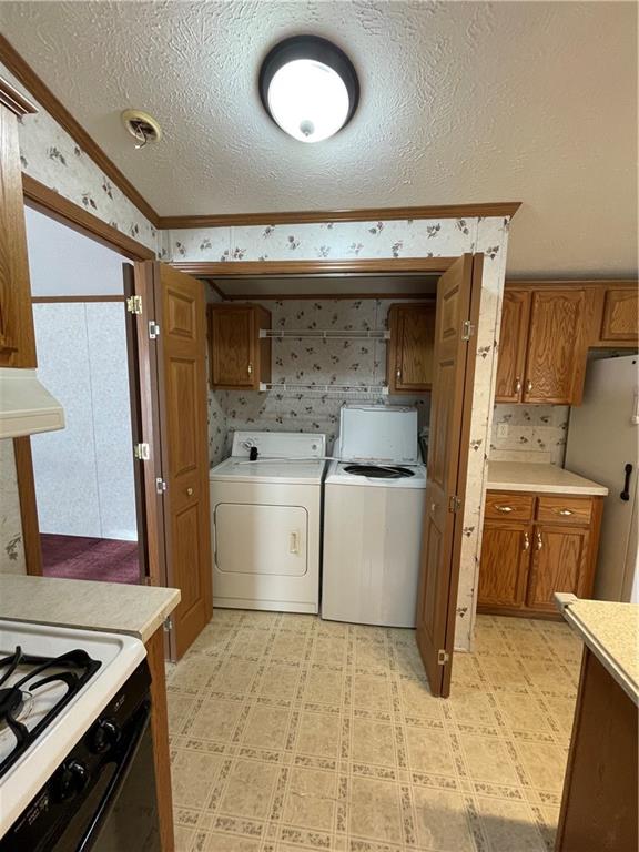 604 Deana Way Rochester, PA 15074 - Photo 12 of 25 a kitchen with a stove and a refrigerator
