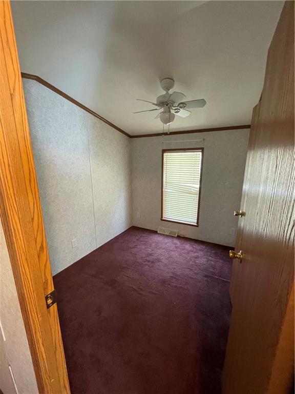 604 Deana Way Rochester, PA 15074 - Photo 16 of 25 en empty room with windows and ceiling fan