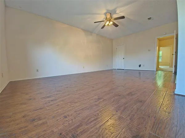a large bathroom with a granite countertop sink and a mirror