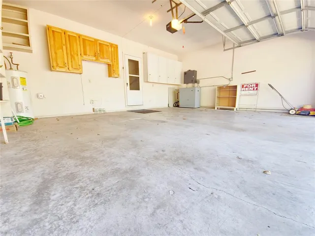 a view of a kitchen with a sink and wooden floor