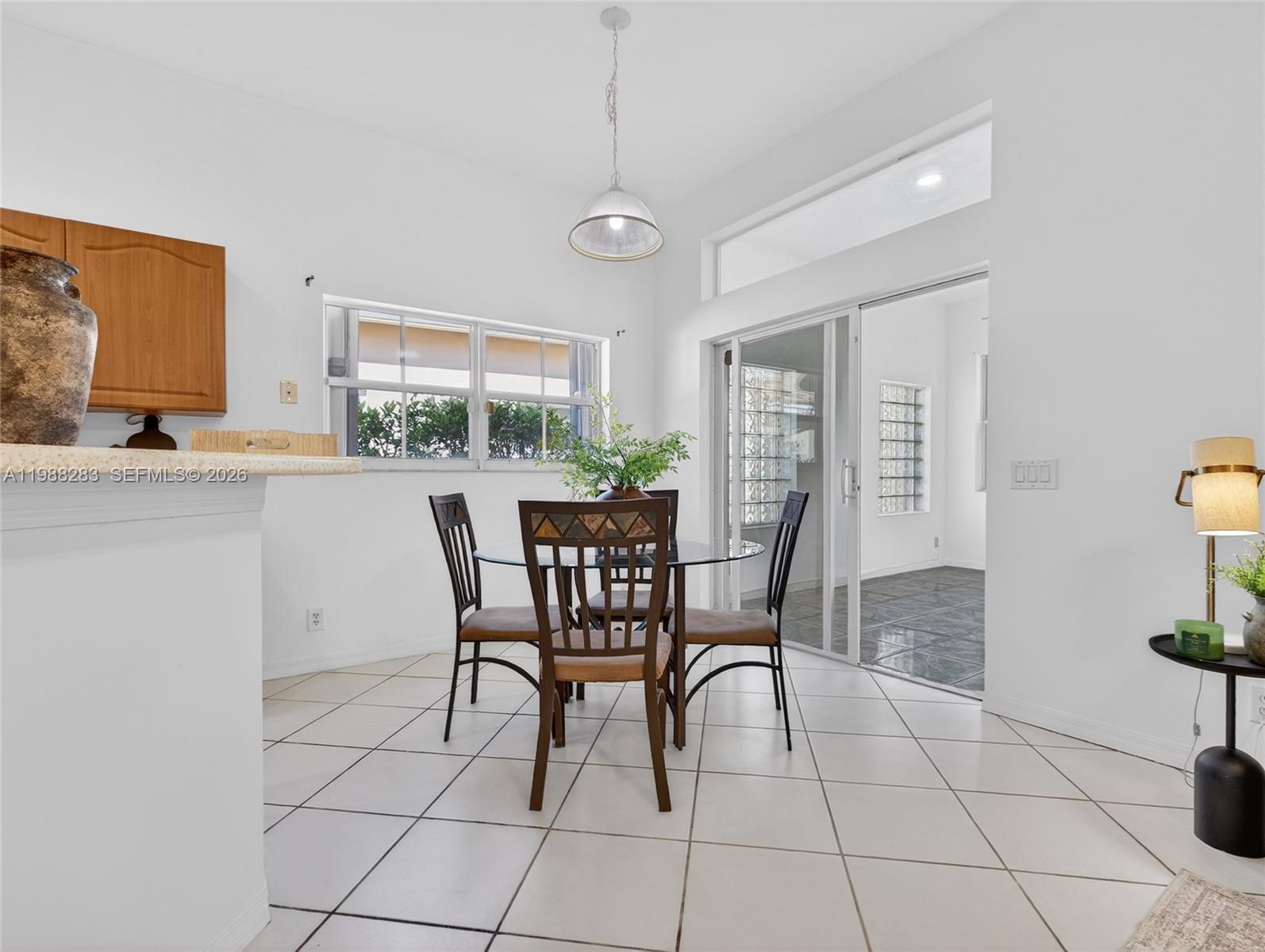 4317 Willow Ridge Drive Weston, FL 33331 - Photo 12 of 71 a dining room with furniture and window