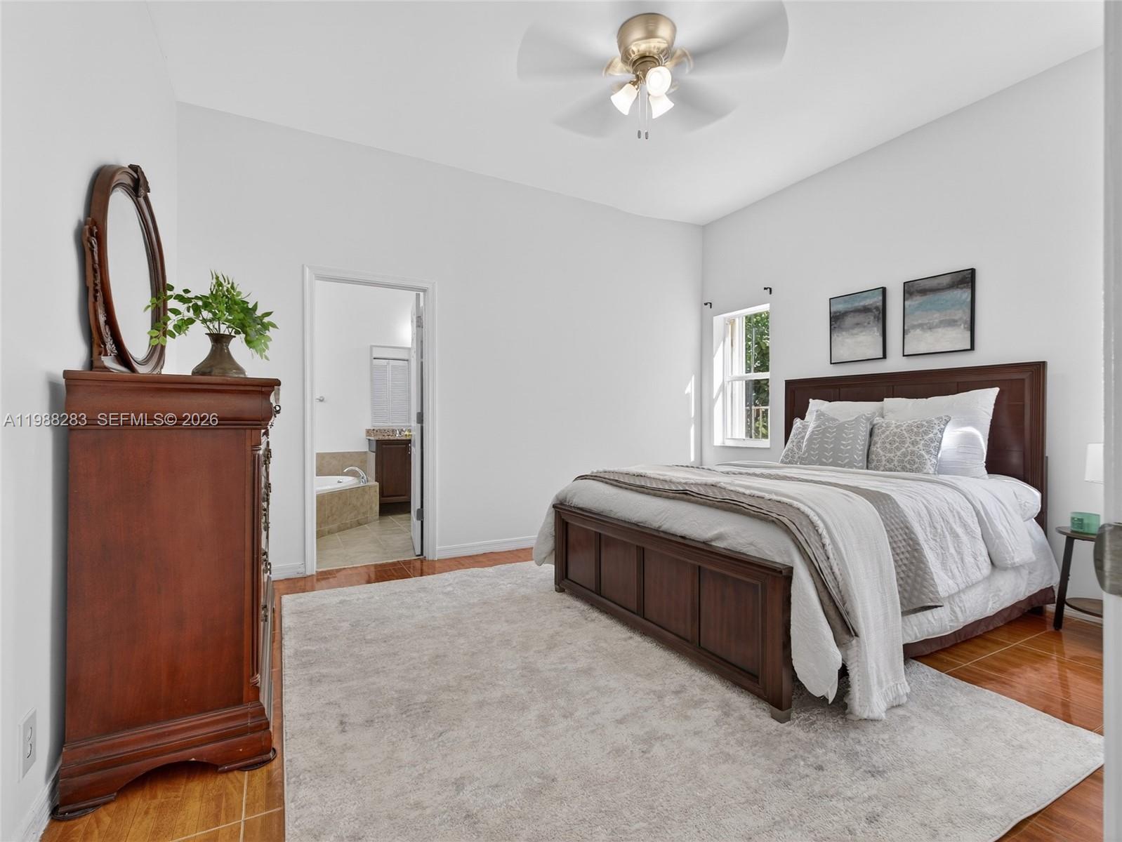 4317 Willow Ridge Drive Weston, FL 33331 - Photo 16 of 71 a spacious bedroom with a bed and a dresser