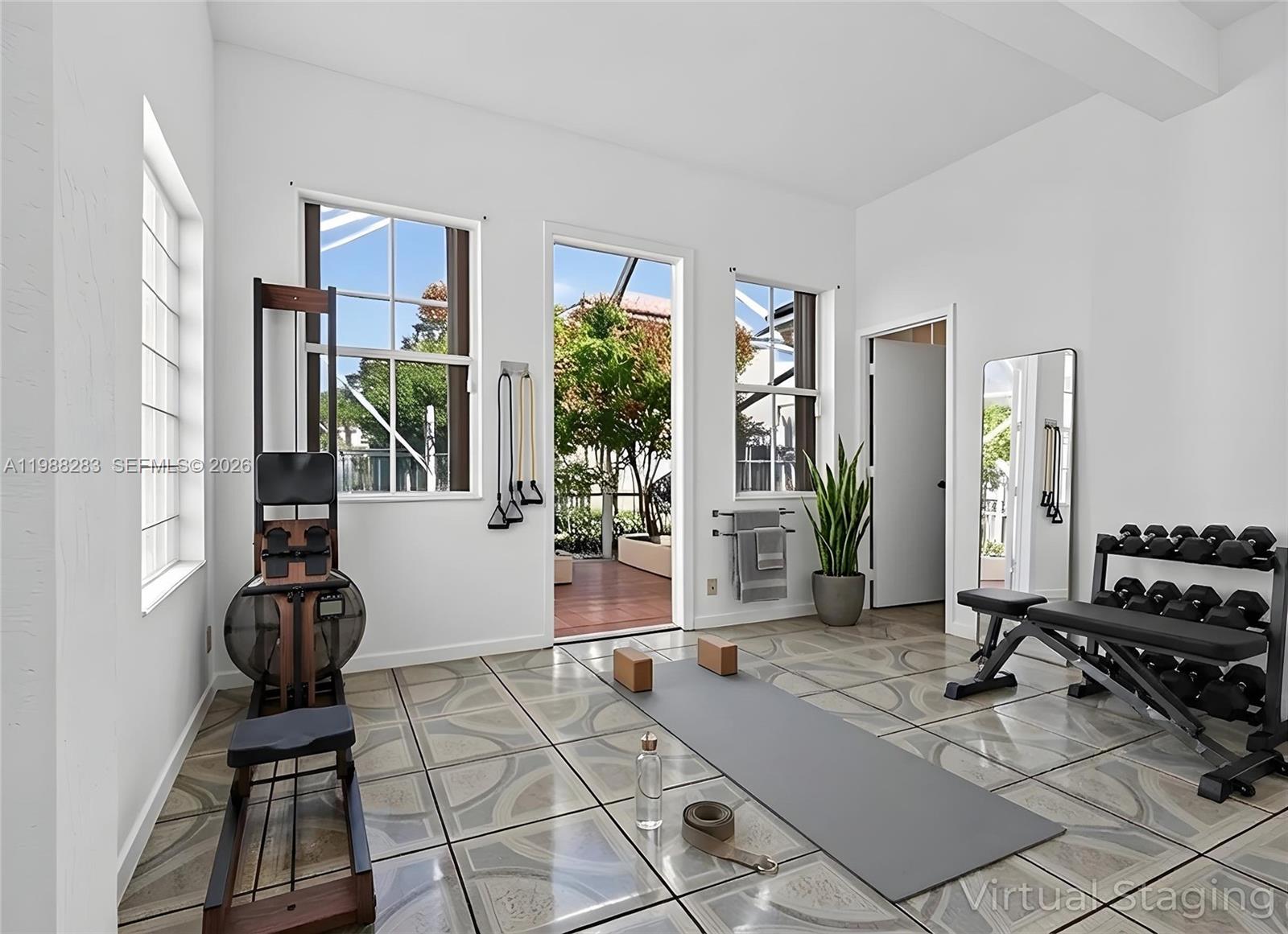 4317 Willow Ridge Drive Weston, FL 33331 - Photo 31 of 71 a room with gym equipment and large windows