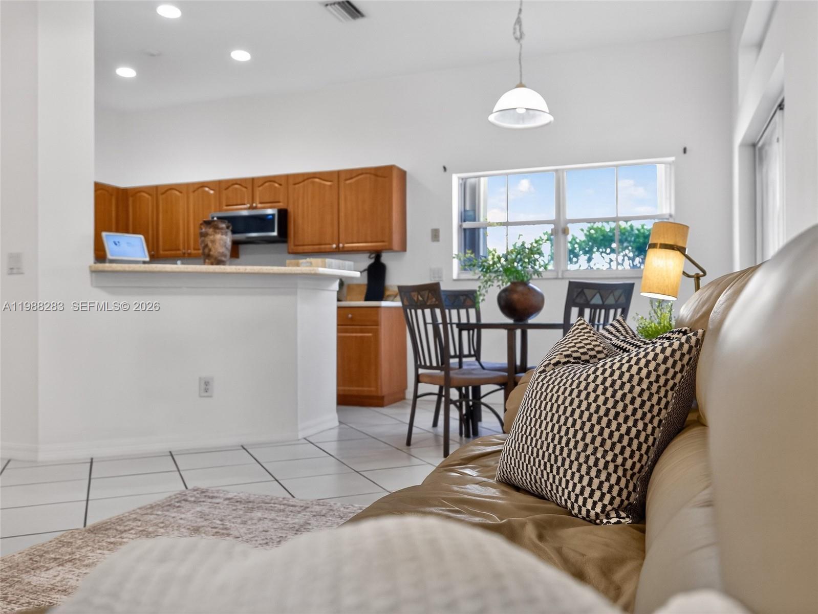 4317 Willow Ridge Drive Weston, FL 33331 - Photo 34 of 71 a dining room with furniture and window