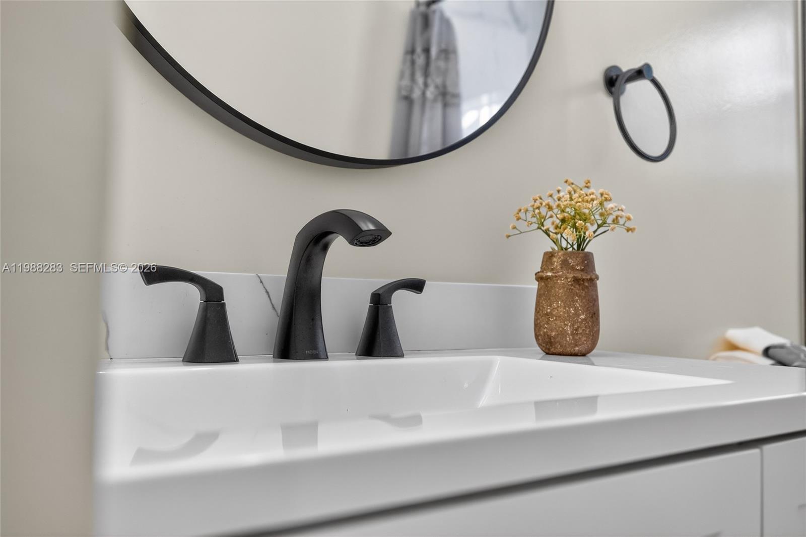 4317 Willow Ridge Drive Weston, FL 33331 - Photo 39 of 71 a bathroom with a sink and a mirror