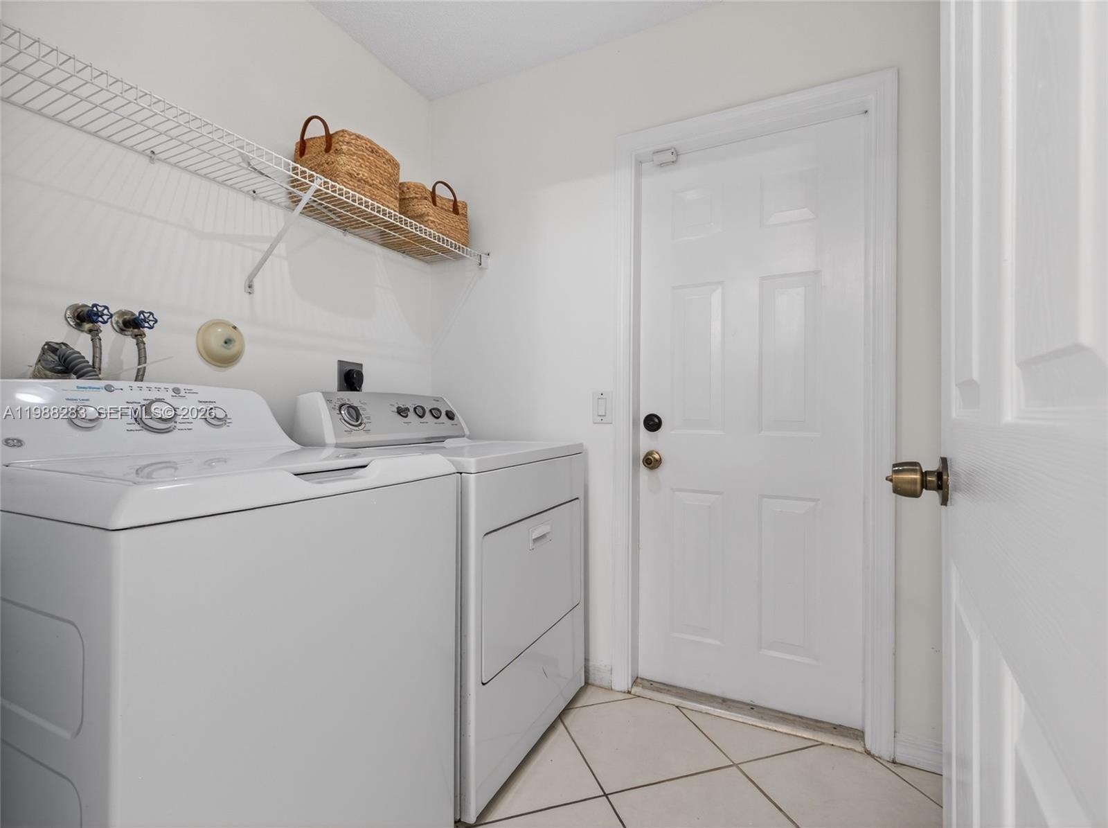 4317 Willow Ridge Drive Weston, FL 33331 - Photo 43 of 71 a utility room with dryer and washer