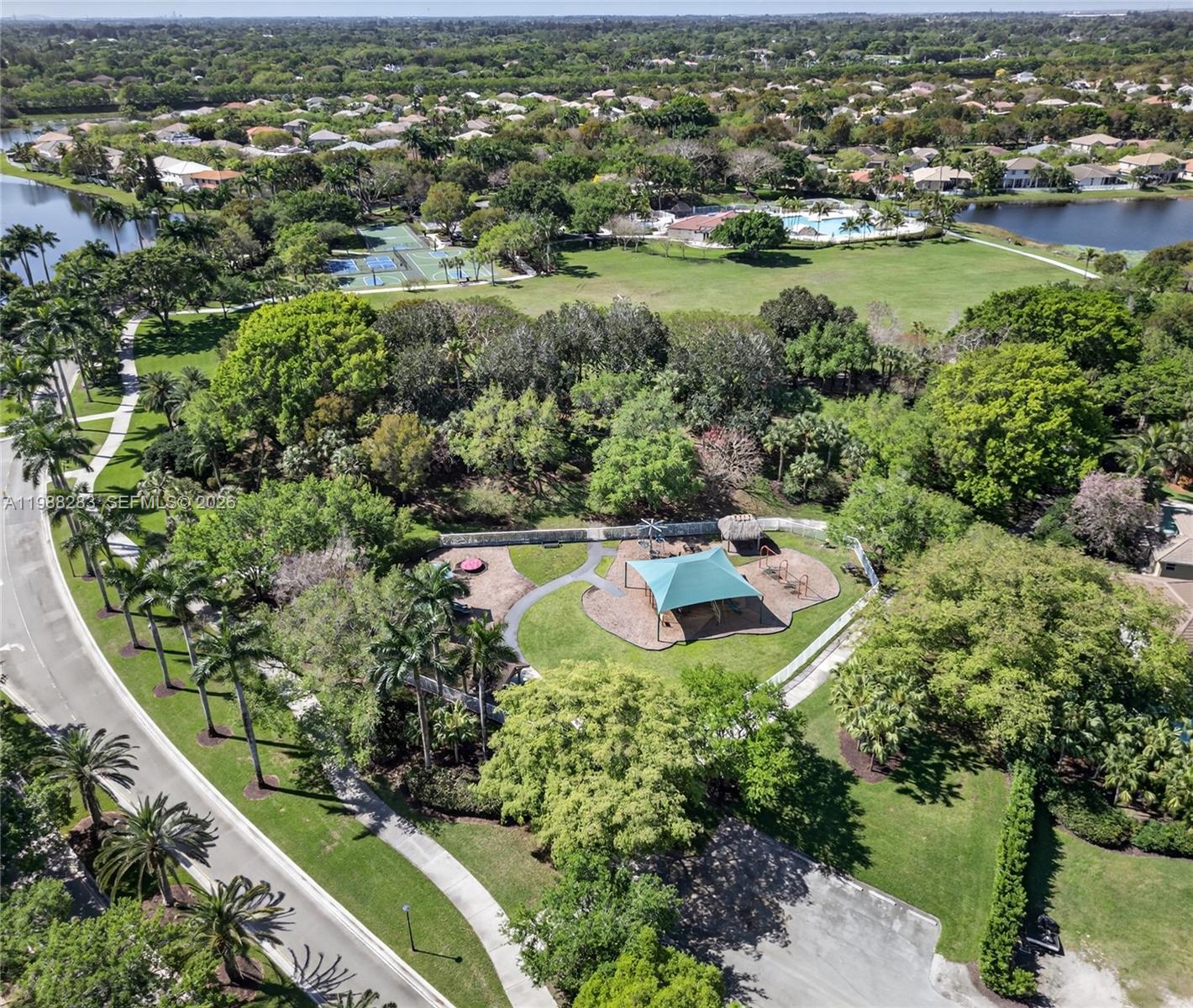 4317 Willow Ridge Drive Weston, FL 33331 - Photo 66 of 71 an aerial view of residential houses with outdoor space and trees