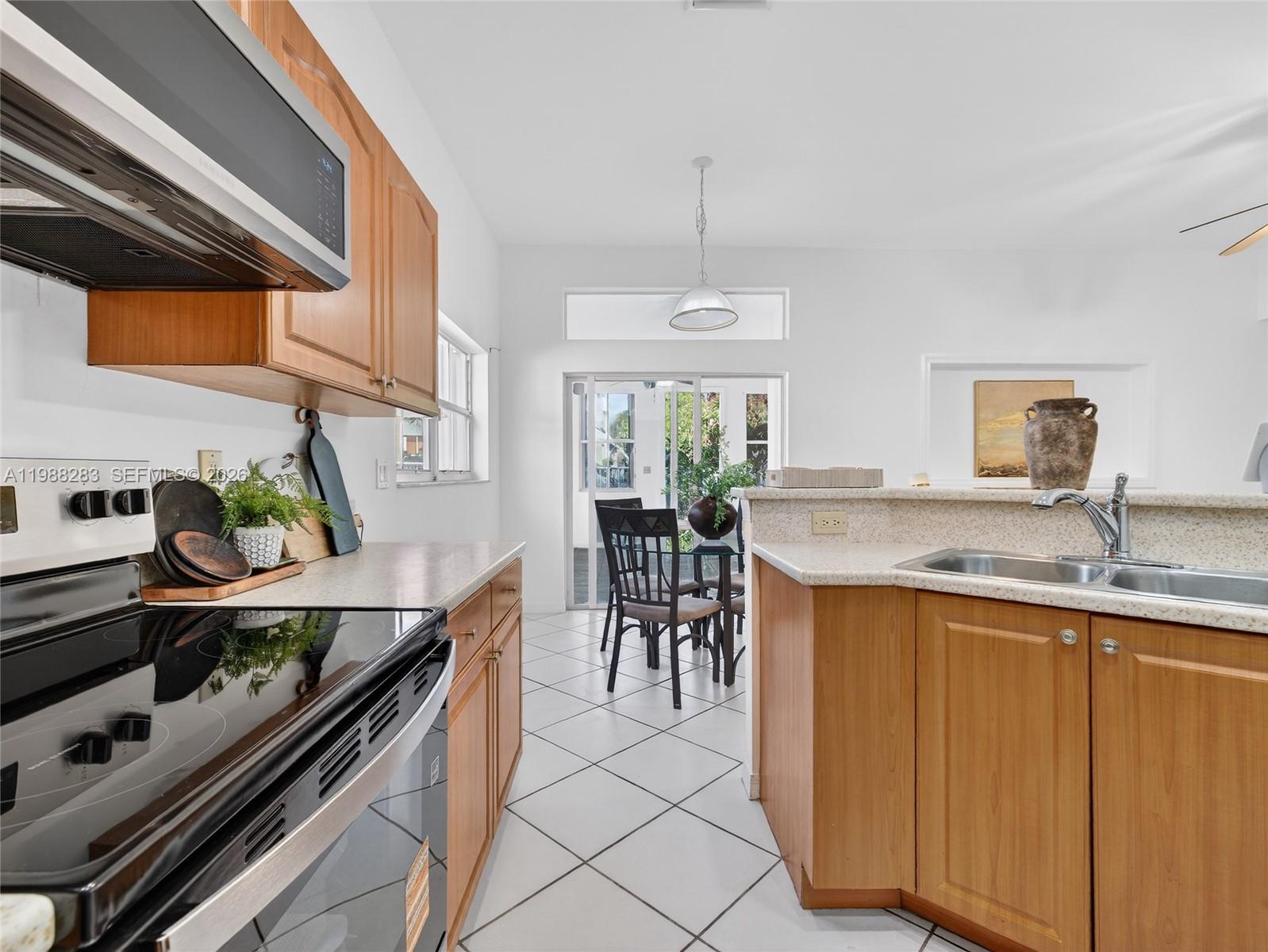 4317 Willow Ridge Drive Weston, FL 33331 - Photo 10 of 71 a kitchen with kitchen island granite countertop lots of counter top space and furniture