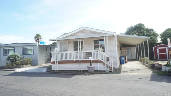 a front view of a house with a porch