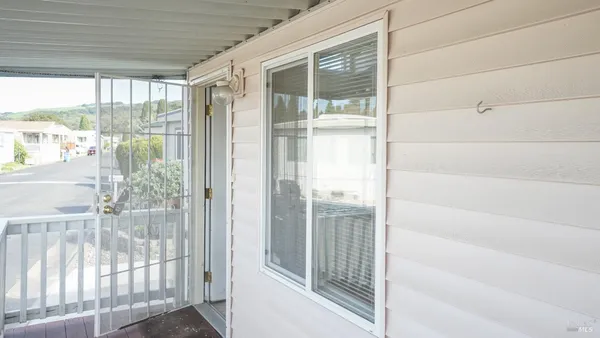 a view of a glass door and a window