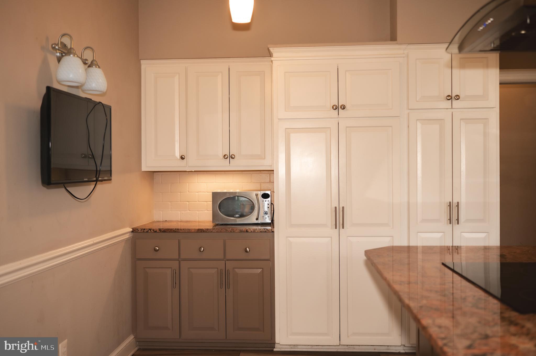 660 Country Club Road Culpeper, VA 22701 - Photo 28 of 69 a view of a kitchen with wooden floor and cabinets