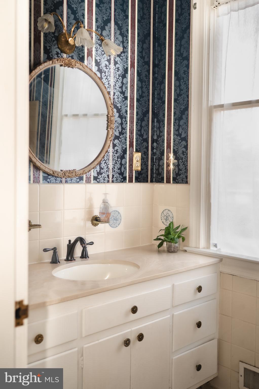 660 Country Club Road Culpeper, VA 22701 - Photo 33 of 69 a bathroom with a sink and a mirror