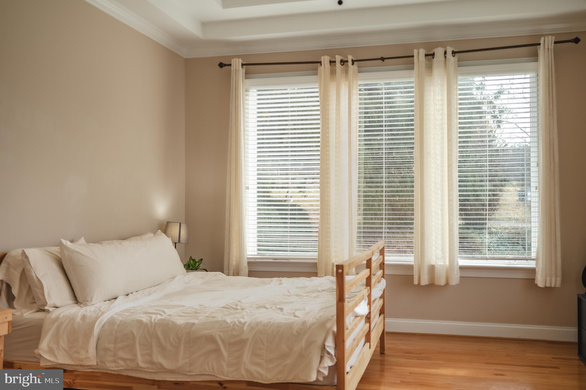660 Country Club Road Culpeper, VA 22701 - Photo 42 of 69 a bedroom with a bed and wooden floor