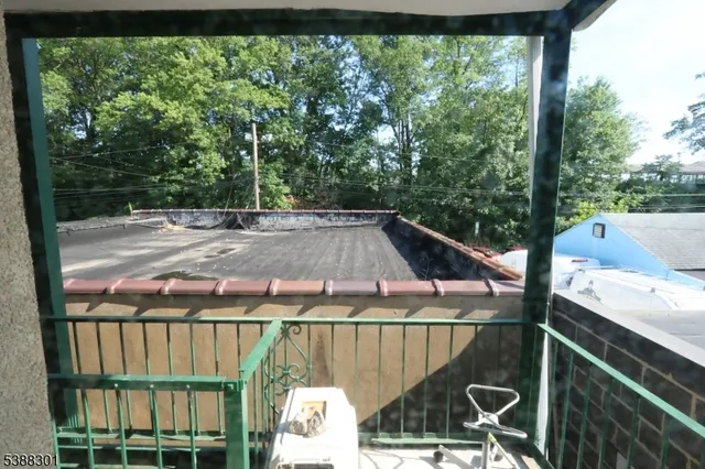 a view of a balcony with chairs