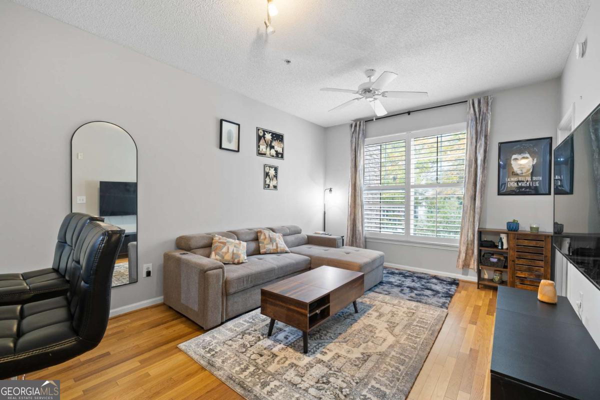 10 Perimeter Summit Boulevard Brookhaven, GA 30319 - Photo 12 of 20 a living room with furniture rug and window