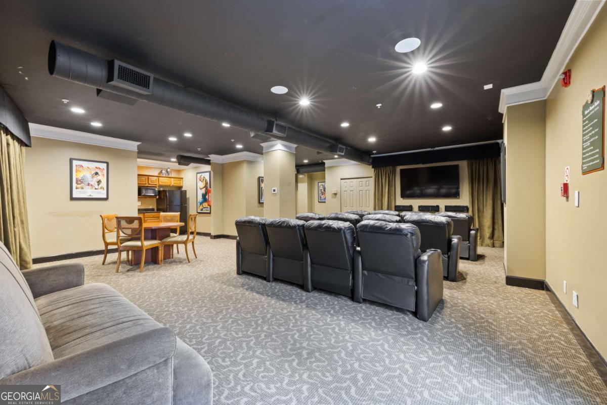 10 Perimeter Summit Boulevard Brookhaven, GA 30319 - Photo 2 of 20 a living room with furniture and a large window
