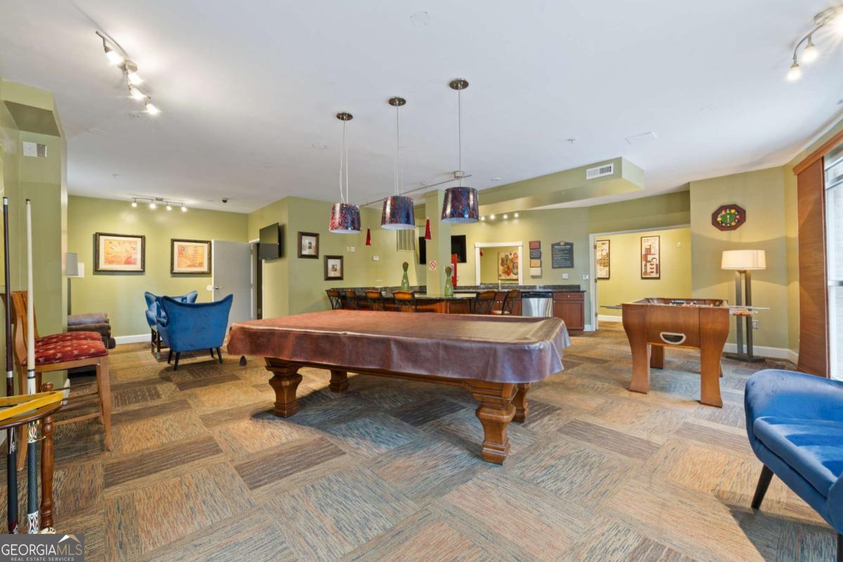 10 Perimeter Summit Boulevard Brookhaven, GA 30319 - Photo 5 of 20 a living room with furniture and a dining table with wooden floor