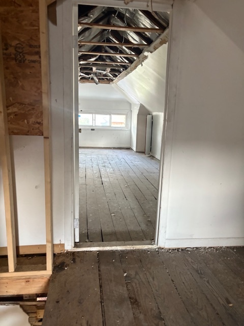 7744 South Rhodes Avenue Chicago, IL 60619 - Photo 12 of 14 an empty room with wooden floor and windows