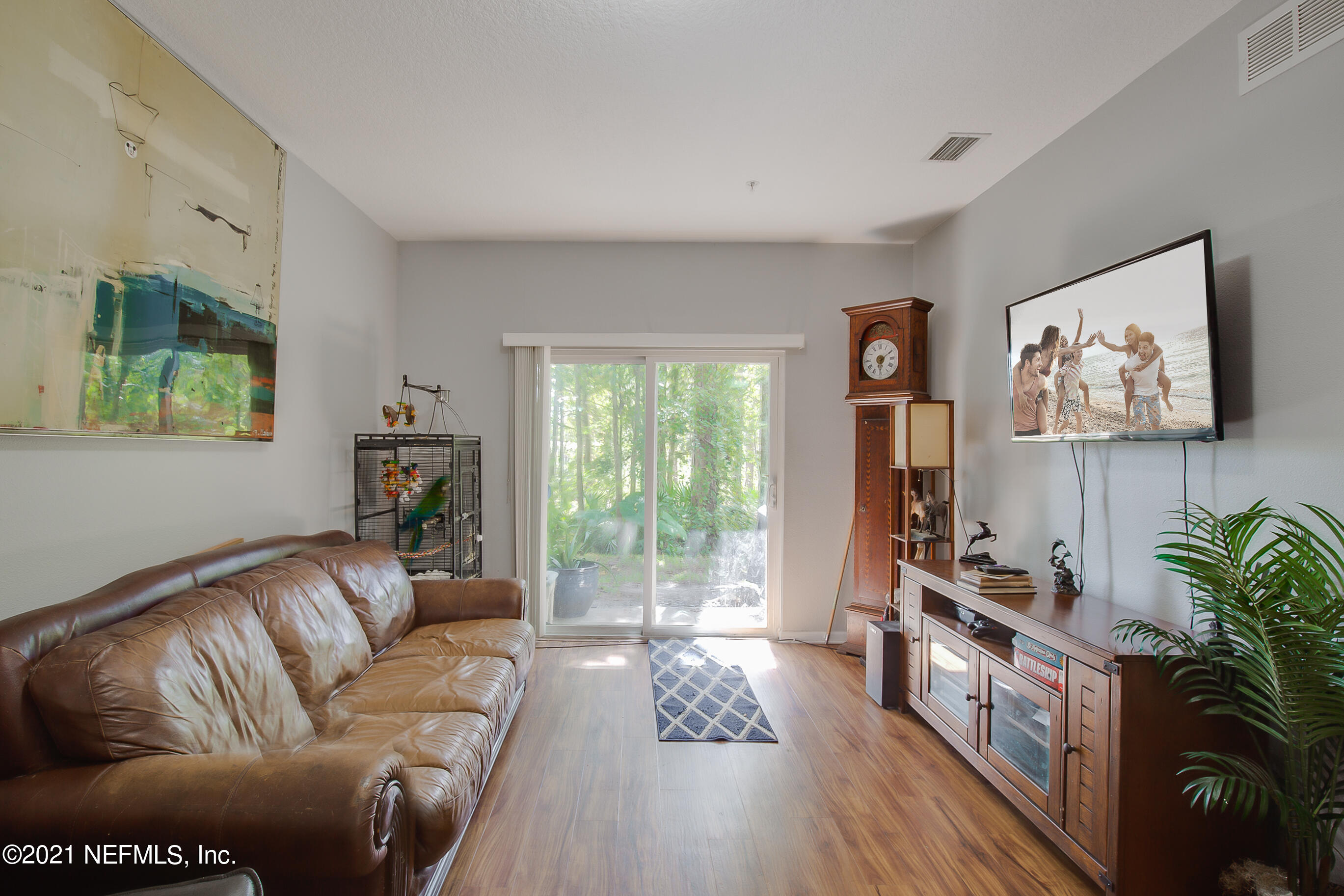 2455 Golden Lake Loop St. Augustine, FL 32084 - Photo 3 of 13 a living room with furniture and a flat screen tv