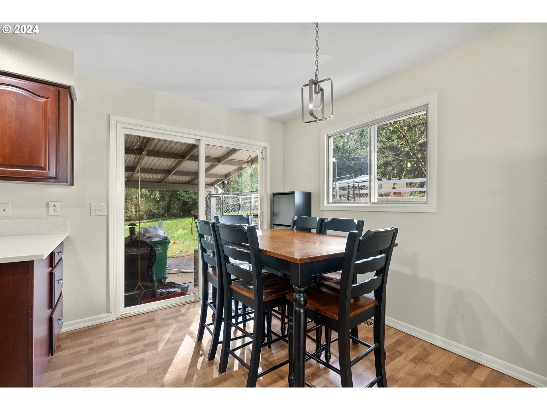 17086 South Gronlund Road Oregon City, OR 97045 - Photo 11 of 34 a view of a dining room with furniture window and outside view