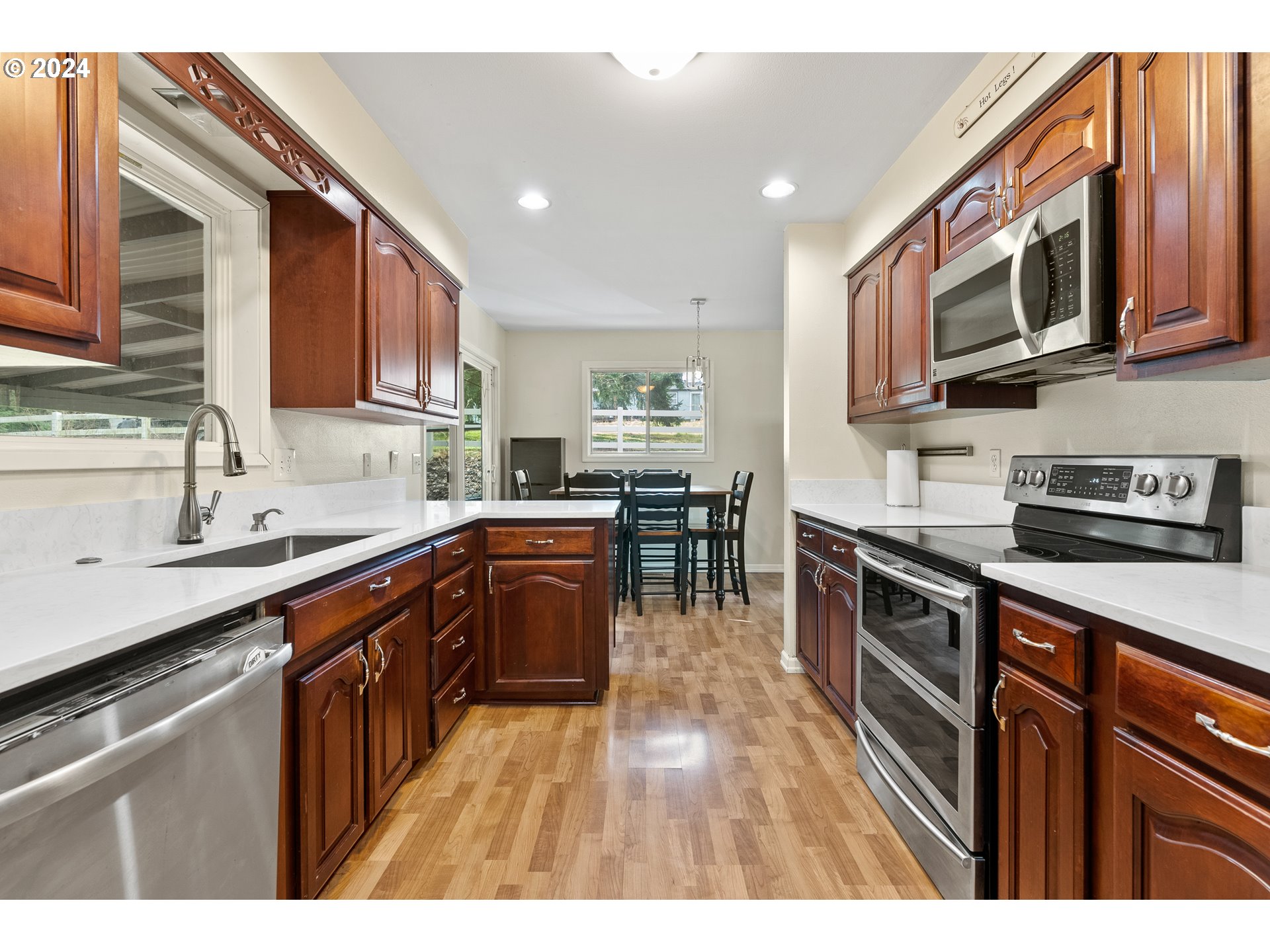 17086 South Gronlund Road Oregon City, OR 97045 - Photo 7 of 34 a kitchen with stainless steel appliances granite countertop a stove sink microwave and cabinets