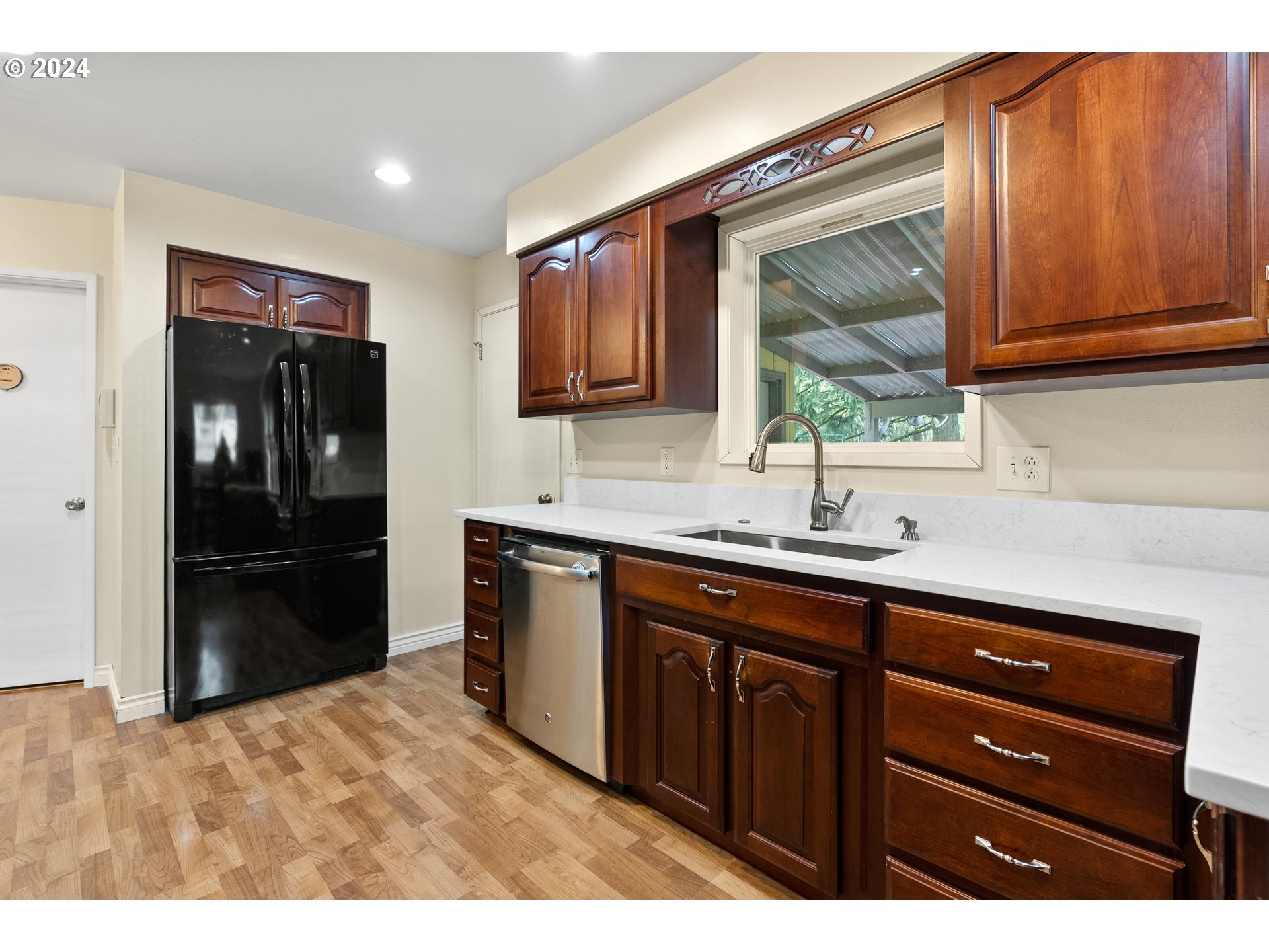 17086 South Gronlund Road Oregon City, OR 97045 - Photo 8 of 34 a kitchen with stainless steel appliances granite countertop a refrigerator and a sink