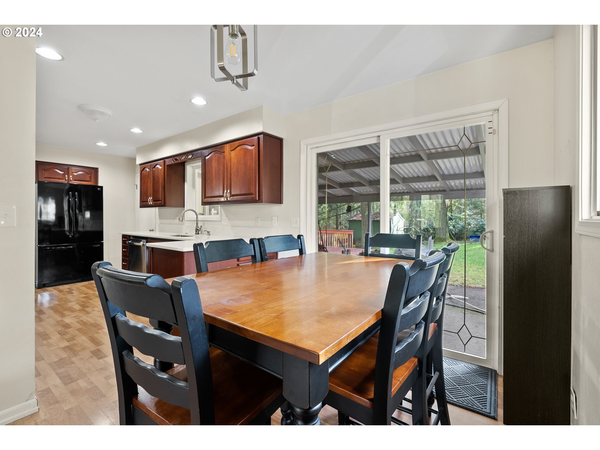 17086 South Gronlund Road Oregon City, OR 97045 - Photo 10 of 34 a view of a dining room with furniture and a window