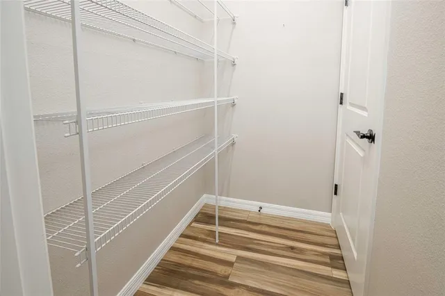 a view of an empty walk in closet